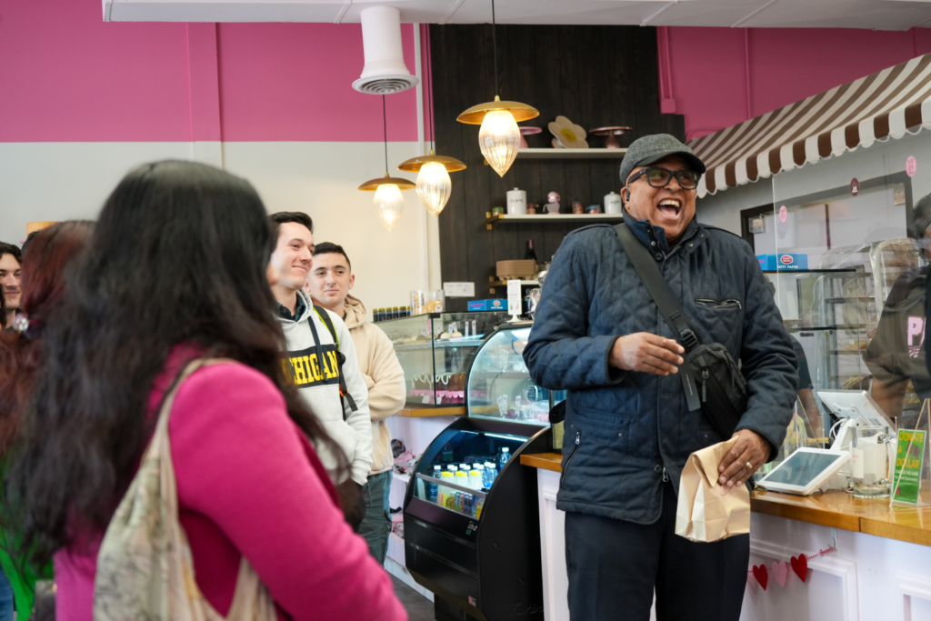 David Tarver laughs along with students at a stop on the Detroit Trek.